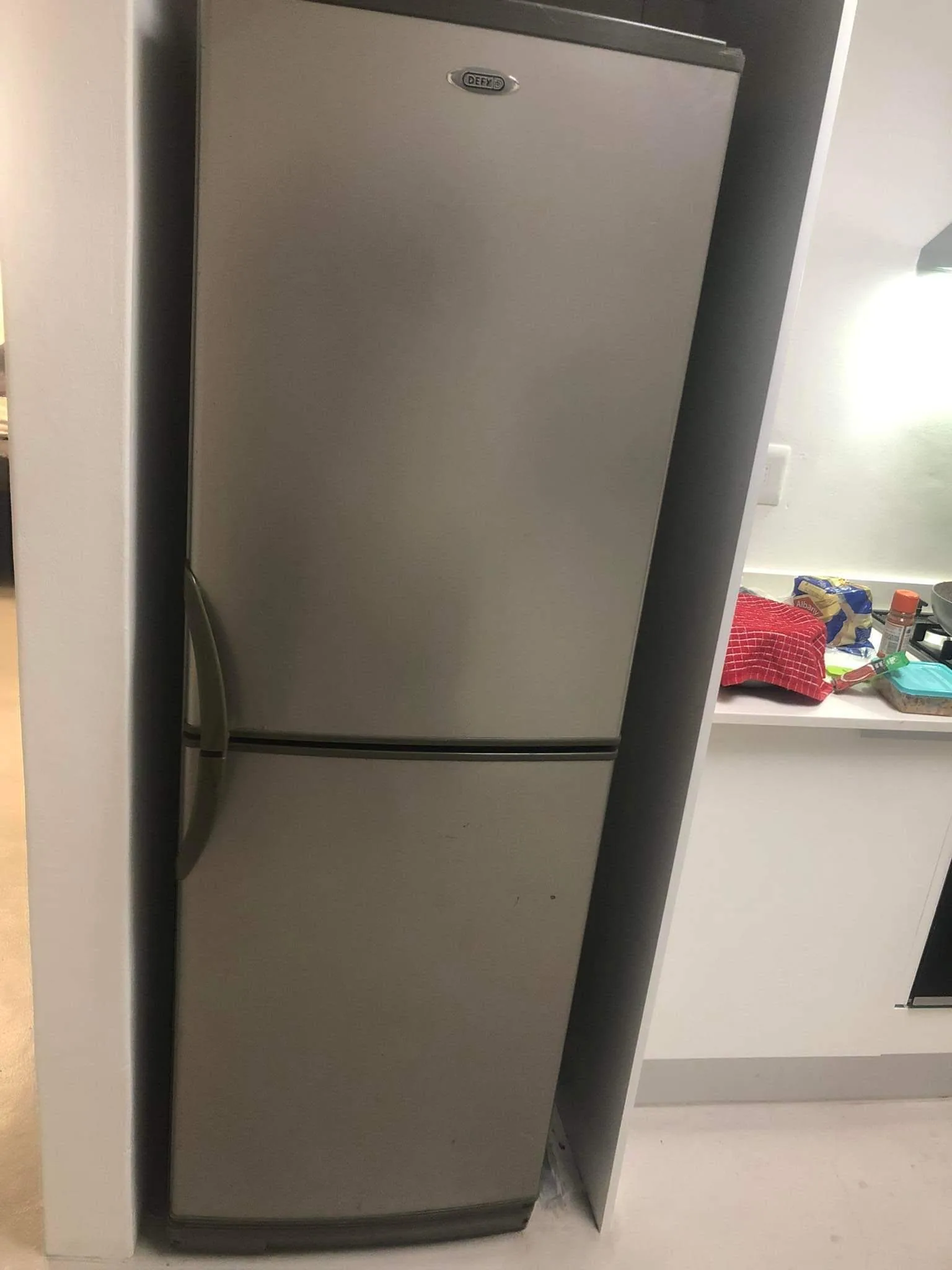 BOLO technician repairing a fridge in Cape Town